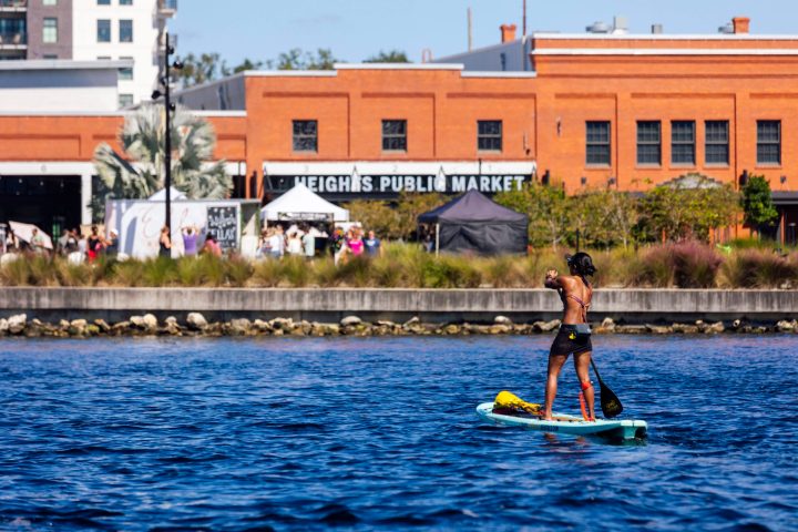 a person riding on the back of a boat in the water