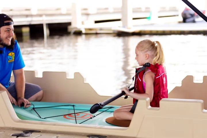 a group of people on a boat in the water